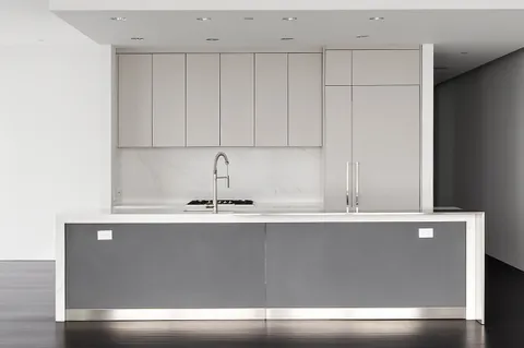 a close view of sink and cabinets