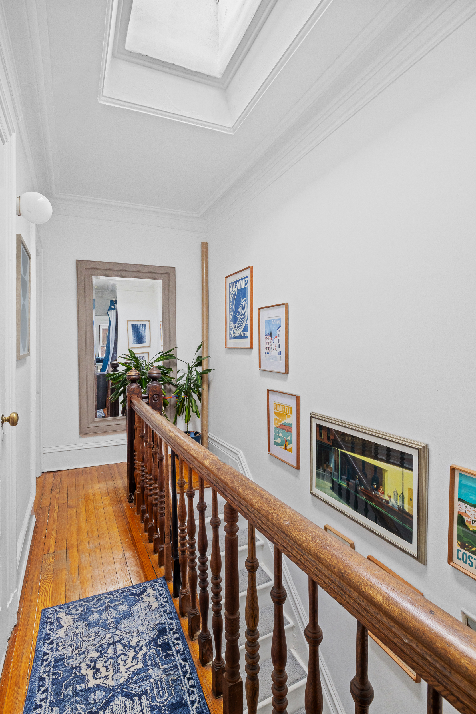 227 Garfield Place, Unit 2 Brooklyn, NY 11215 - Photo 9 of 15 a view of a hallway with wooden floor and staircase