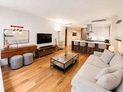 a living room with furniture and a flat screen tv