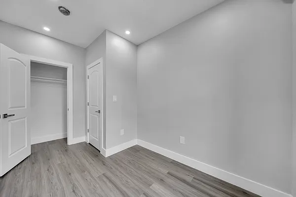 30 Marconi Place, Unit 3 Brooklyn, NY 11233 - Photo 10 of 11 a view of an empty room with wooden floor