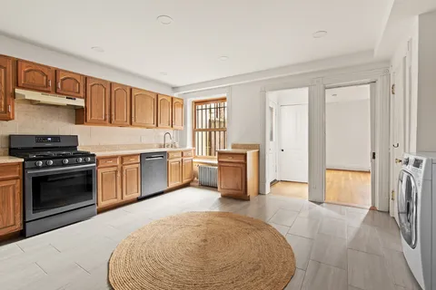 a view of an empty room with a fireplace