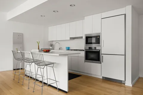 a kitchen with a stove a sink and a refrigerator