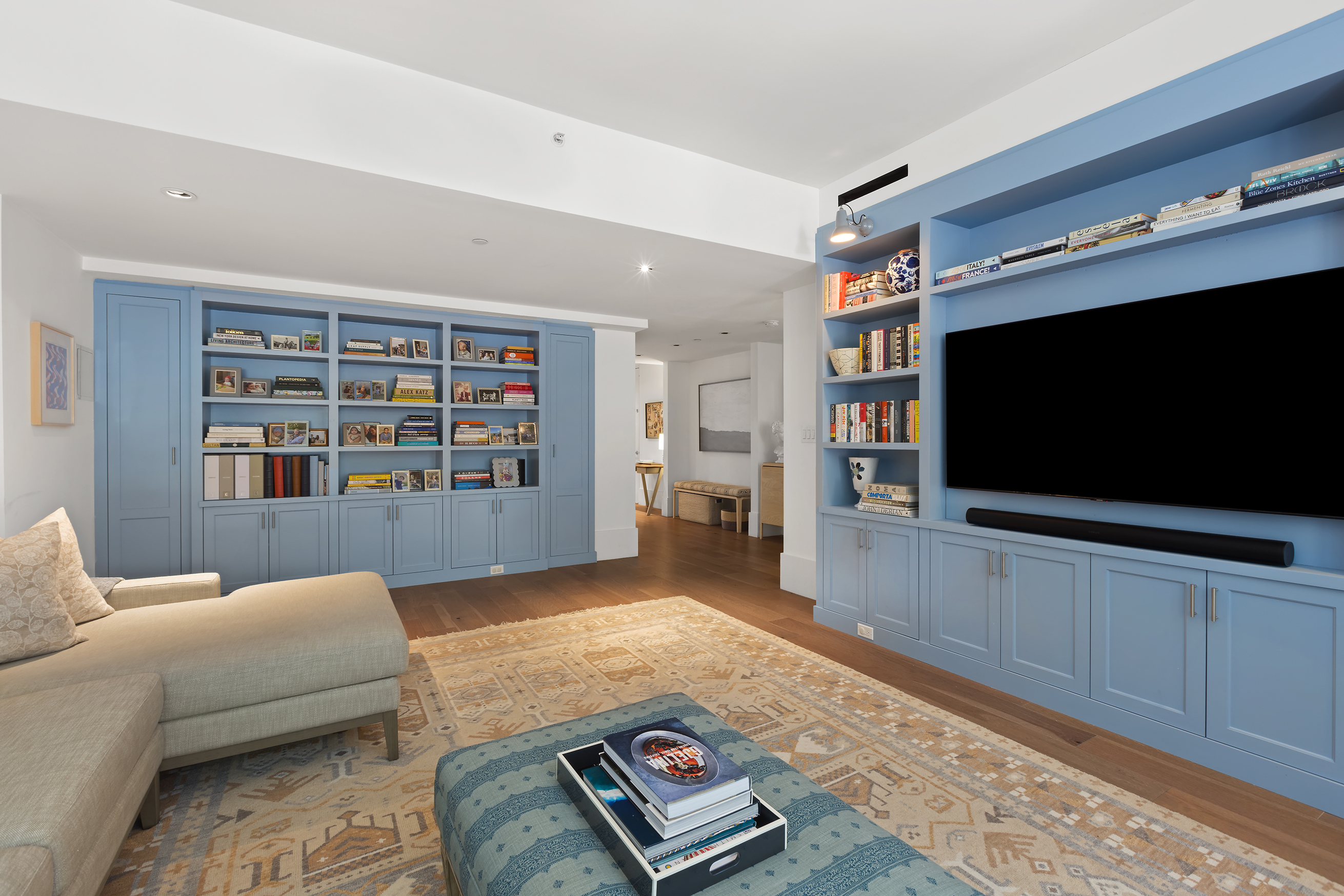 429 Kent Avenue, Unit TH2 Brooklyn, NY 11249 - Photo 2 of 34 a living room with furniture and a flat screen tv