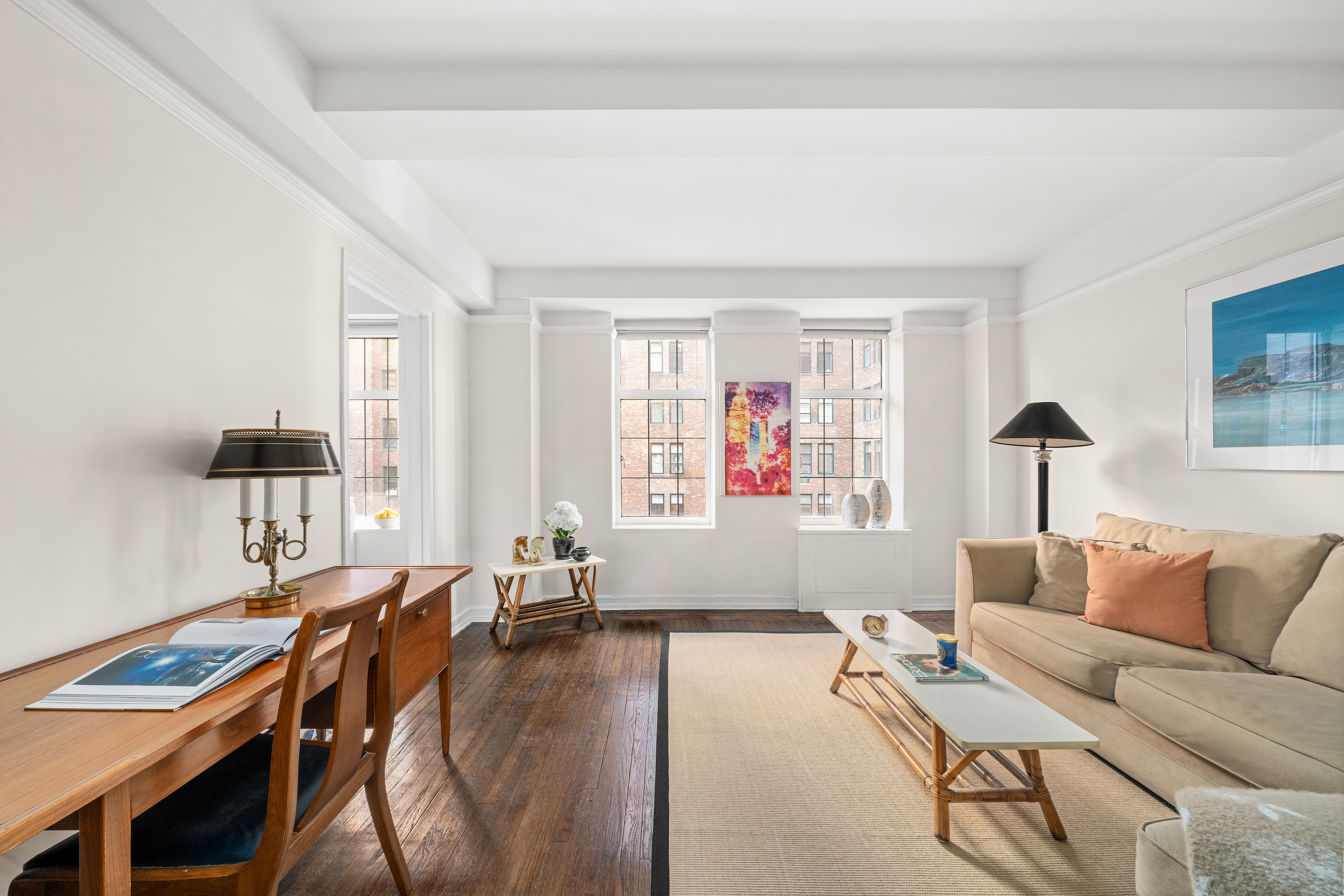 405 West 23rd Street, Unit 9I Manhattan, NY 10011 - Photo 2 of 10 a living room with furniture and a window