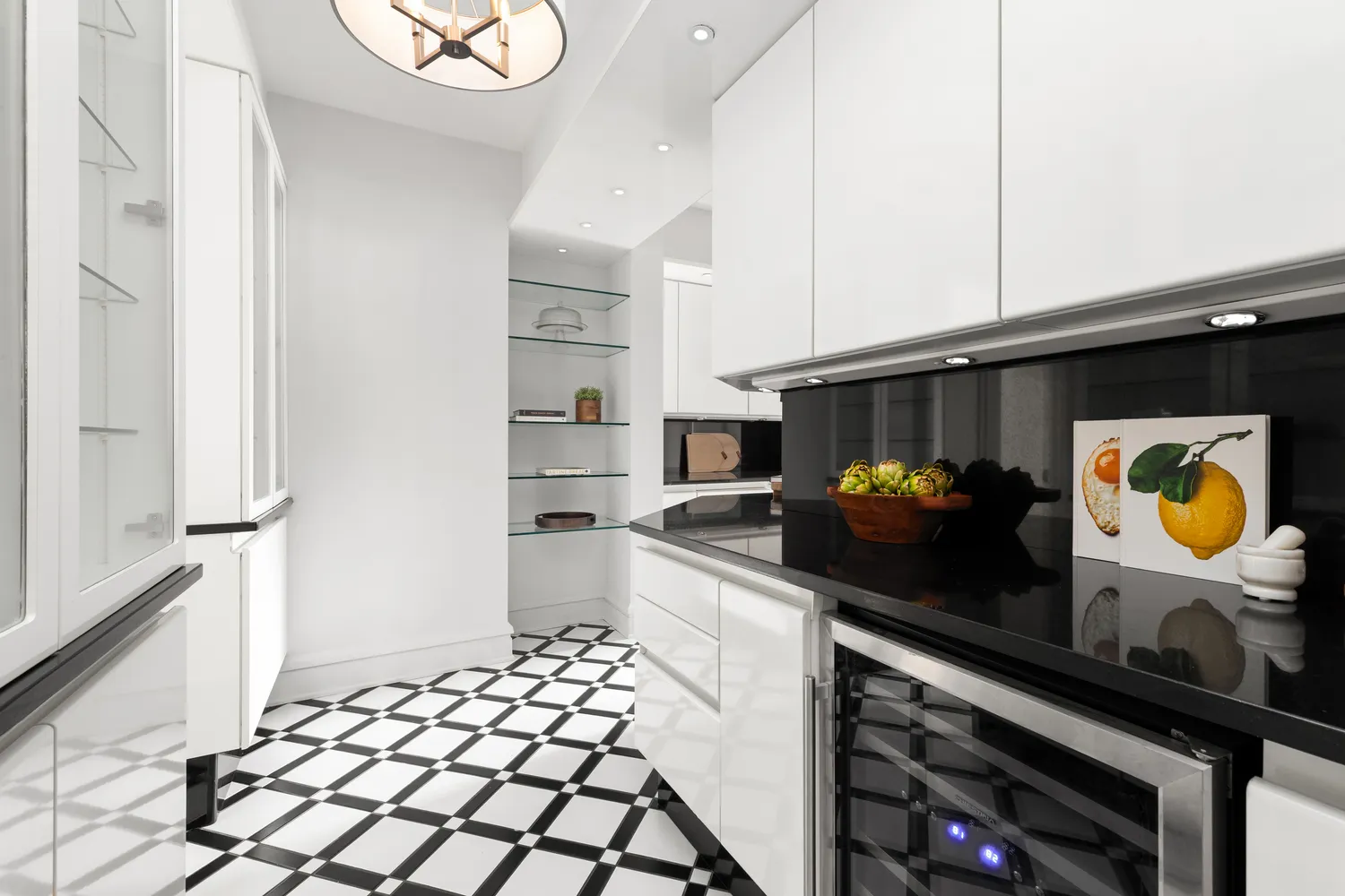 a kitchen with stainless steel appliances a stove a microwave and a refrigerator