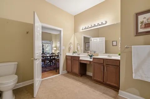 a dining room with furniture window and wooden floor