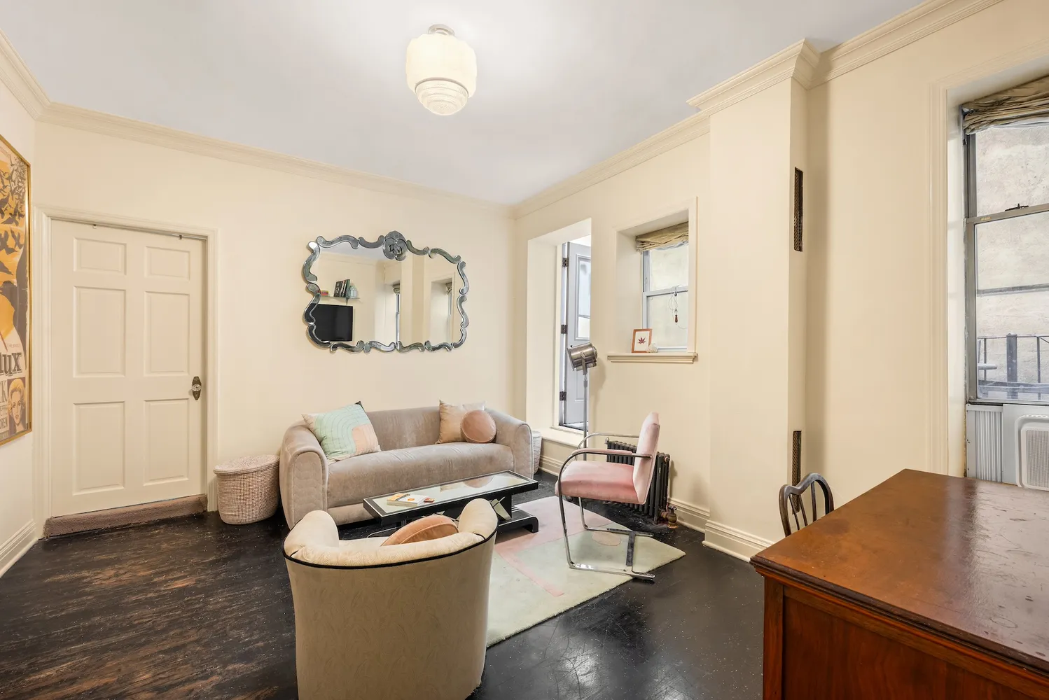 a living room with furniture and wooden floor