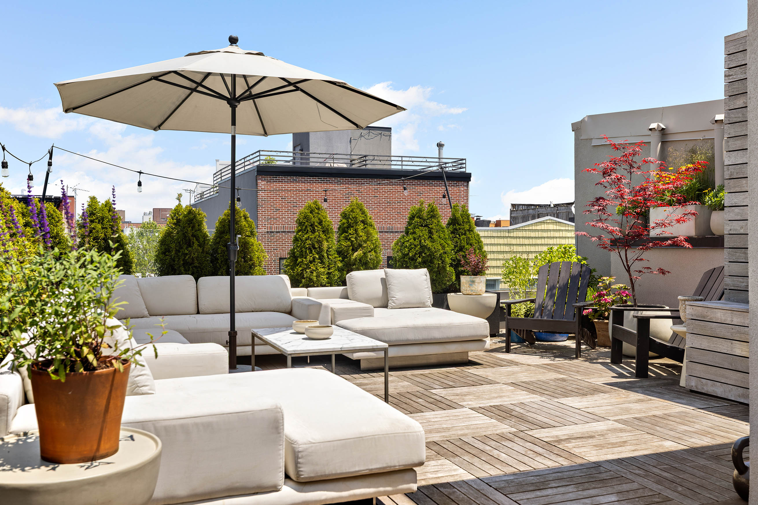 220 North 6th Street, Unit PH Brooklyn, NY 11211 - Photo 12 of 15 a view of a patio with couches and potted plants