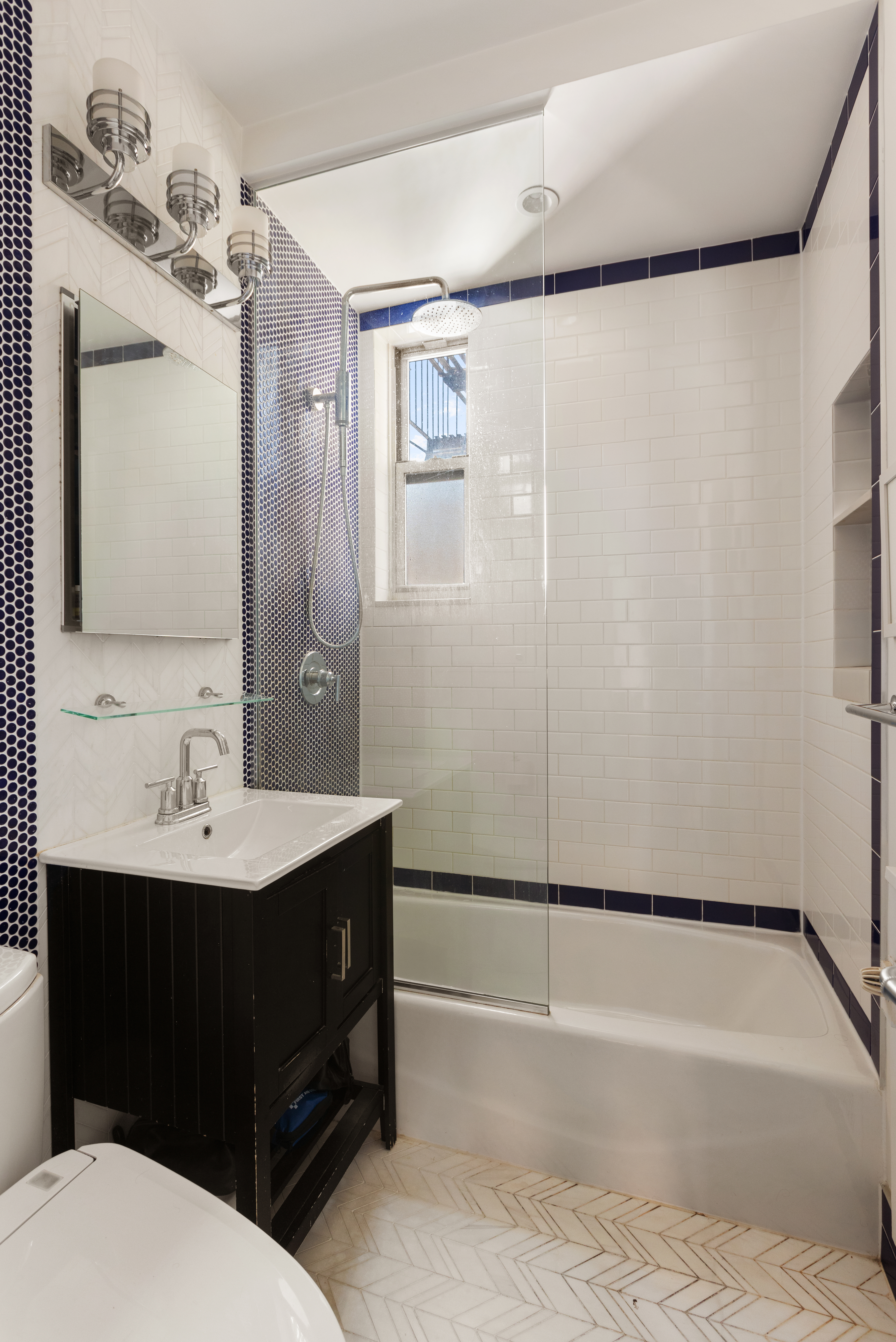 145 Hicks Street, Unit A51 Brooklyn, NY 11201 - Photo 9 of 9 a bathroom with a sink a toilet a mirror and shower