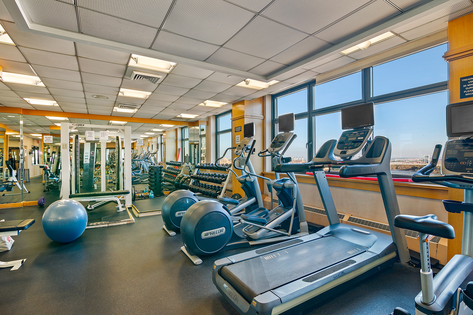 340 East 93rd Street, Unit 27K Manhattan, NY 10128 - Photo 8 of 12 a view of a room with gym equipment