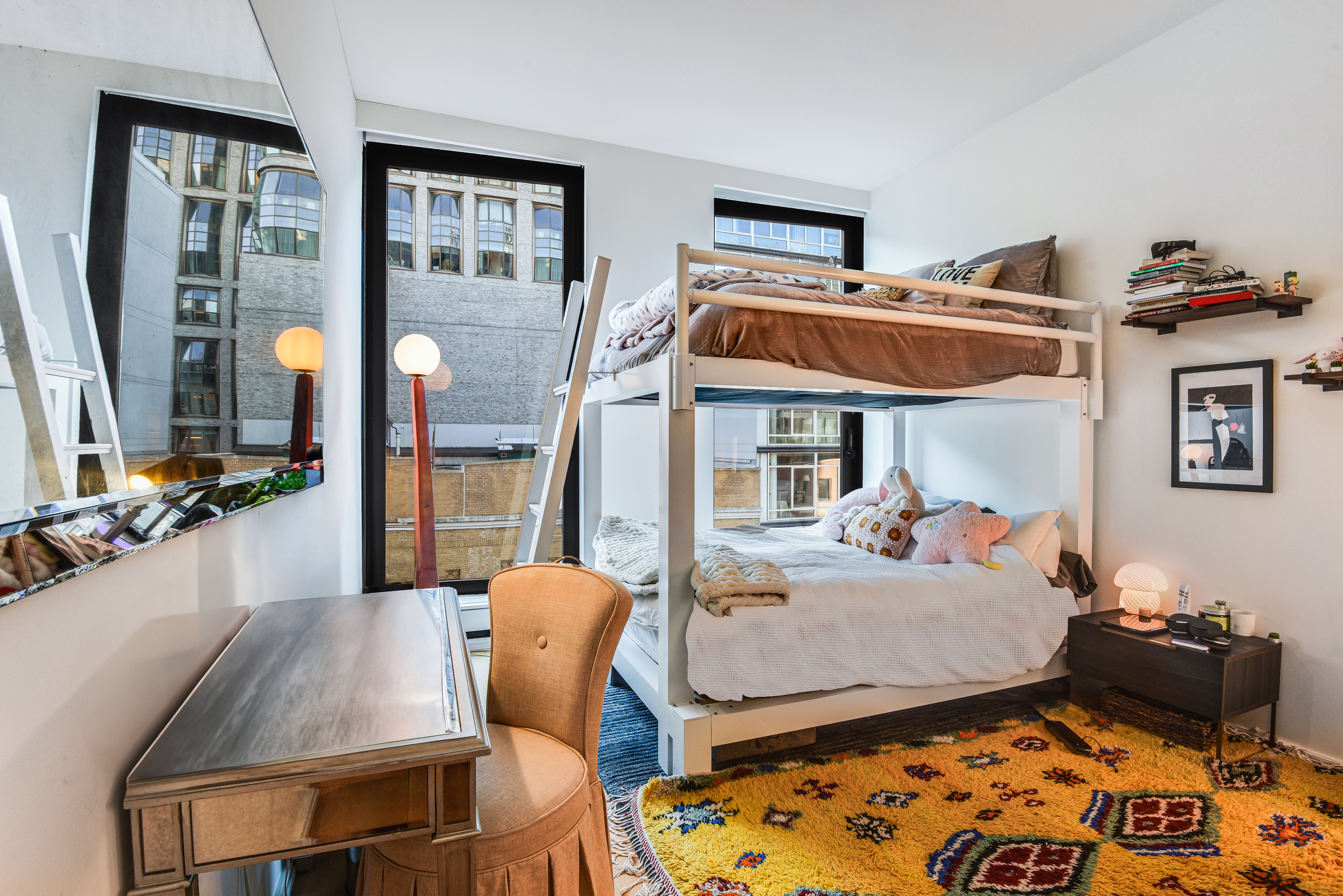 505 West 19th Street, Unit 7W Manhattan, NY 10011 - Photo 19 of 31 a bed room with furniture and a window