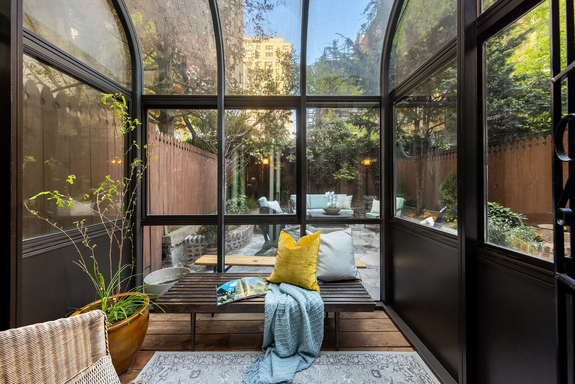 159 West 13th Street Manhattan, NY 10011 - Photo 9 of 36 a living room with furniture and a floor to ceiling window