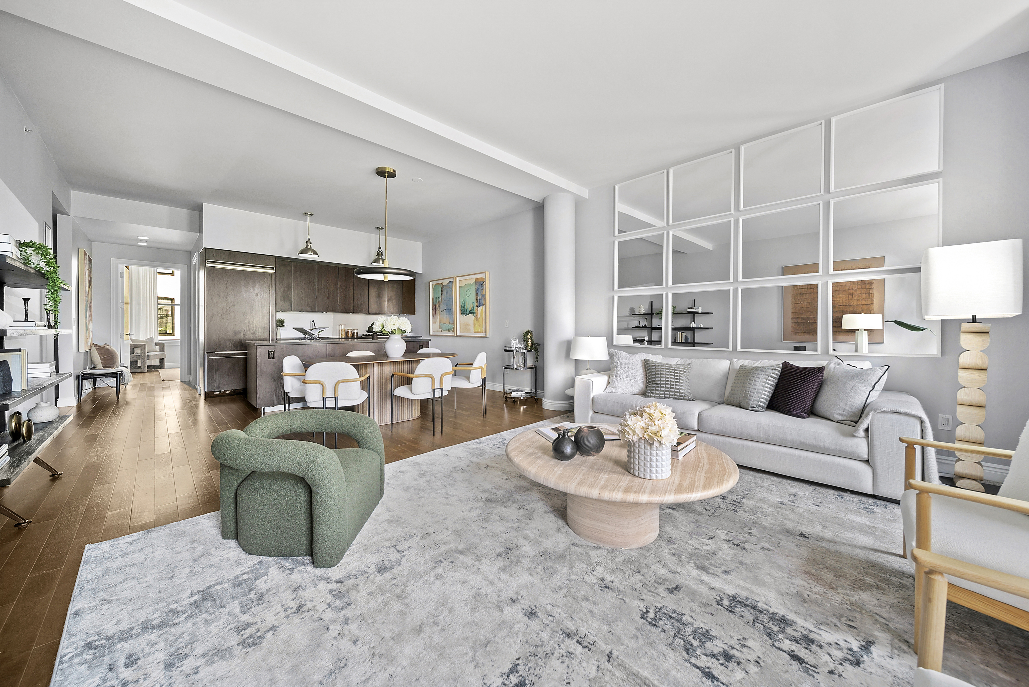 225 5th Avenue, Unit 7K Manhattan, NY 10010 - Photo 4 of 15 a living room with furniture kitchen view and a chandelier