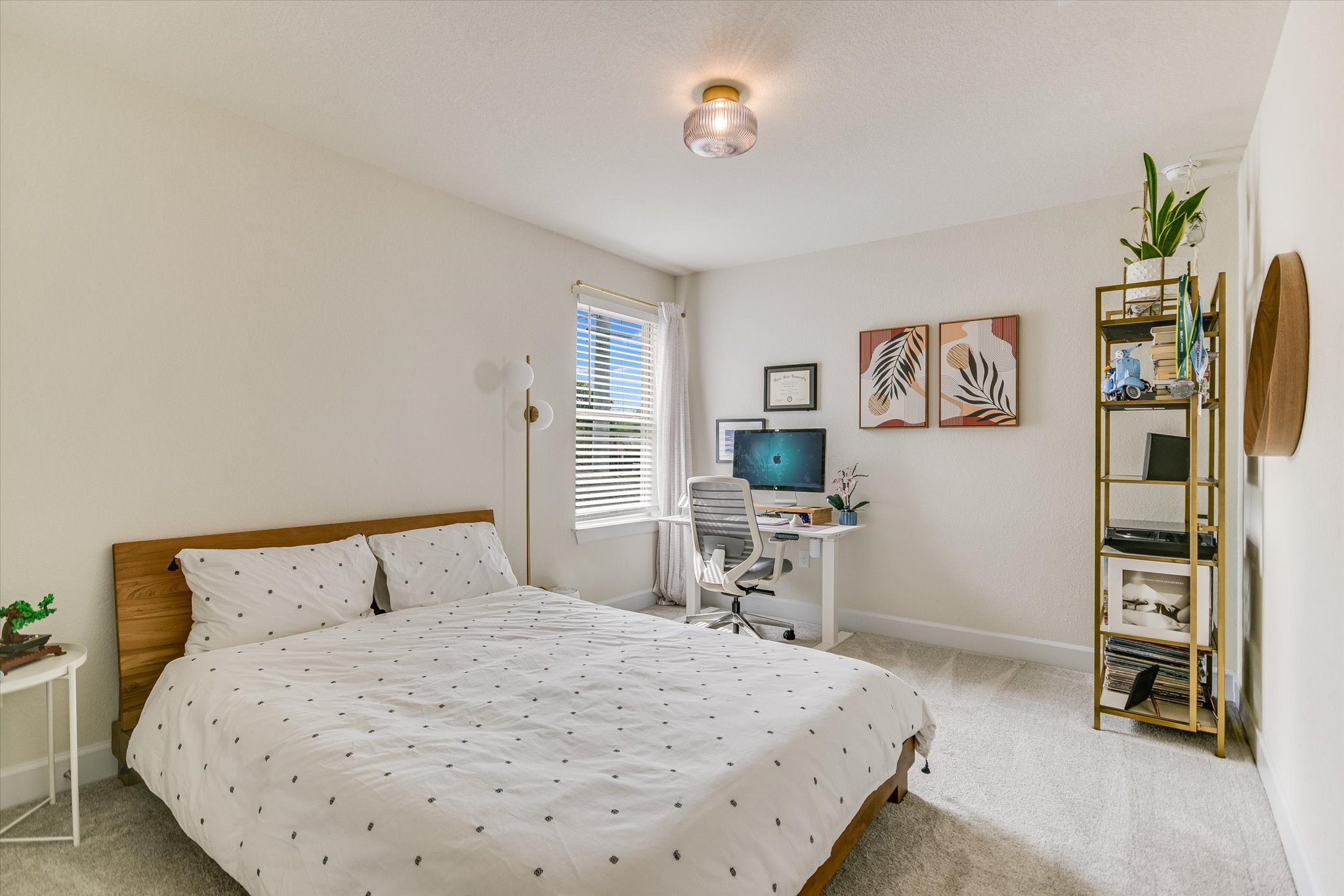 8607 McKamy Drive Austin, TX 78744 - Photo 15 of 28 a bedroom with a bed and a desk in it