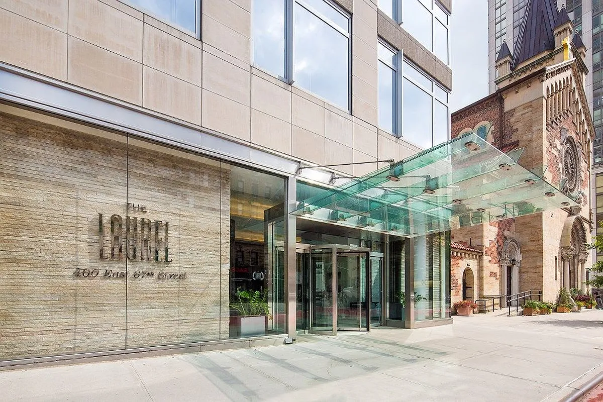 400 East 67th Street, Unit 7G Manhattan, NY 10065 - Photo 14 of 20 a view of a brick building with a street sign