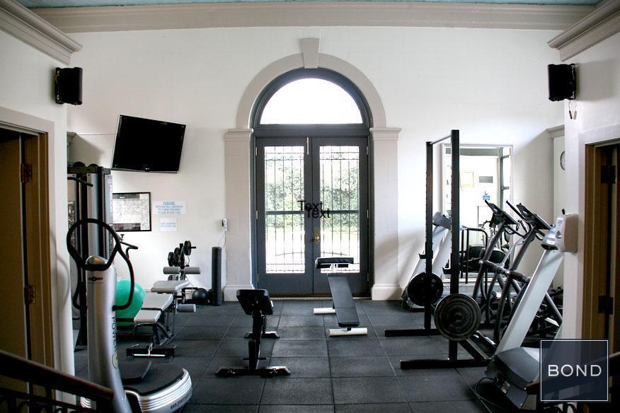 240 Centre Street, Unit 3B Manhattan, NY 10013 - Photo 17 of 23 a living room with furniture a flat screen tv and a large window