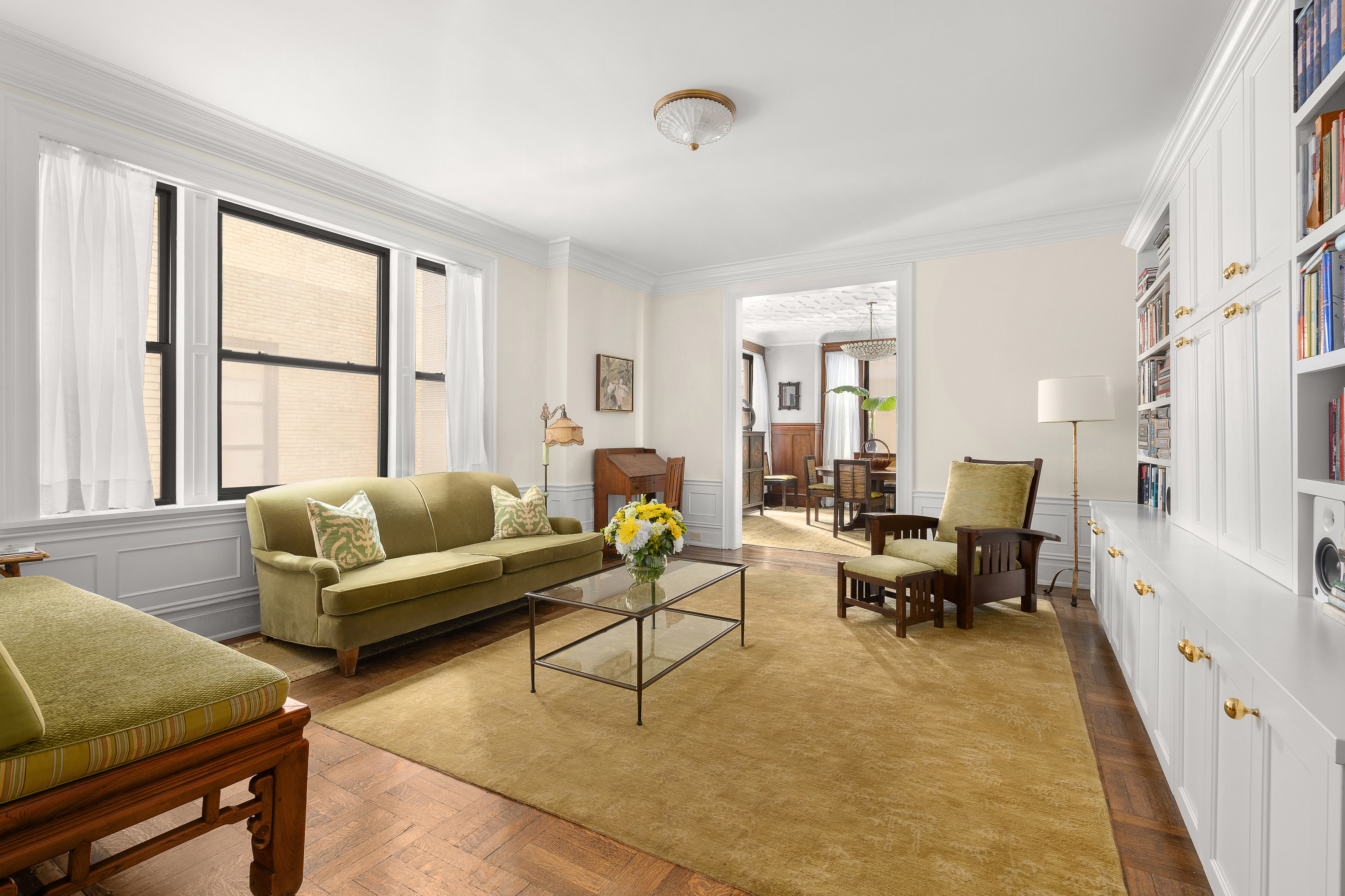 200 West 54th Street, Unit 8G Manhattan, NY 10019 - Photo 2 of 11 a living room with furniture and a window