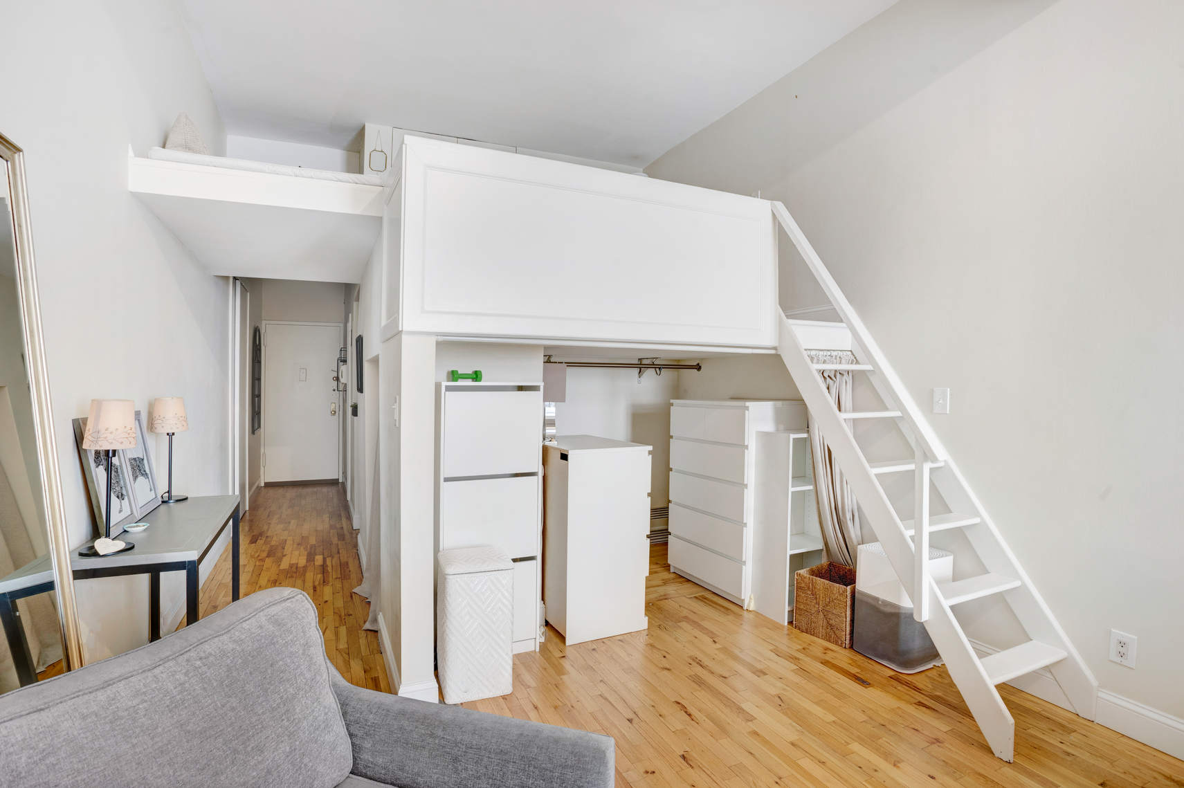 310 East 23rd Street, Unit 7C Manhattan, NY 10010 - Photo 6 of 18 a living room with furniture and a fireplace