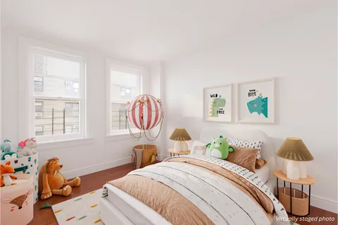 a bedroom with bed and a window