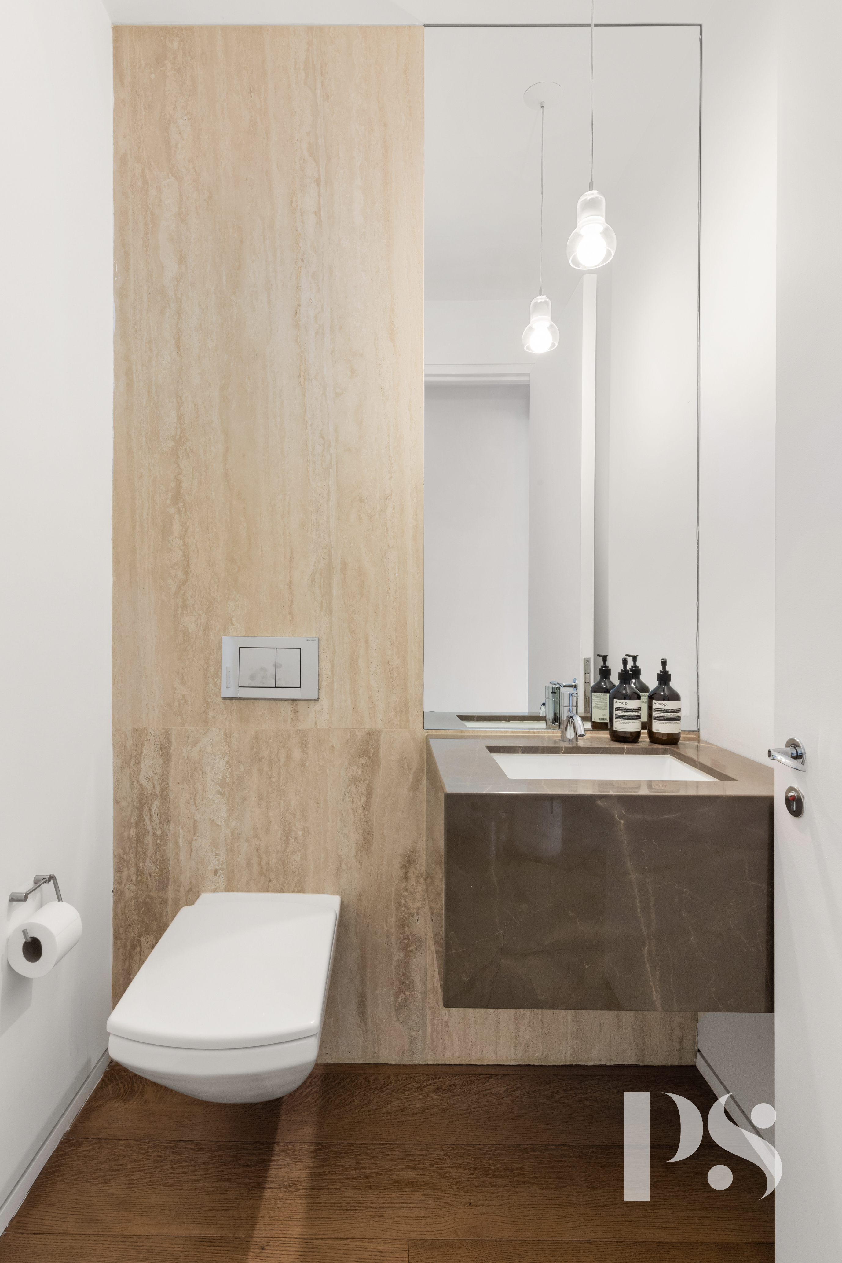 23 East 22nd Street, Unit 8A Manhattan, NY 10010 - Photo 18 of 25 a bathroom with a sink a toilet and mirror