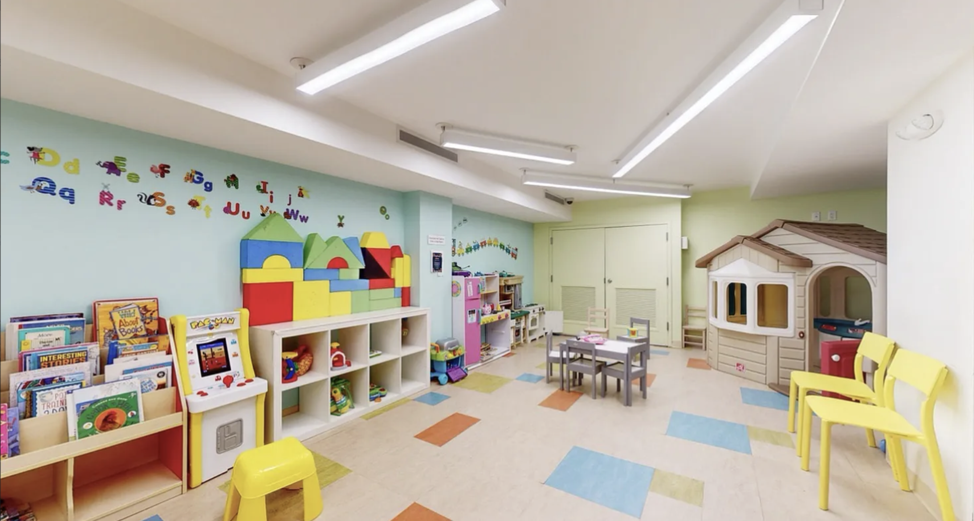 200 Rector Place, Unit 6P Manhattan, NY 10280 - Photo 8 of 10 a living room with lots of baby furniture and baby toys