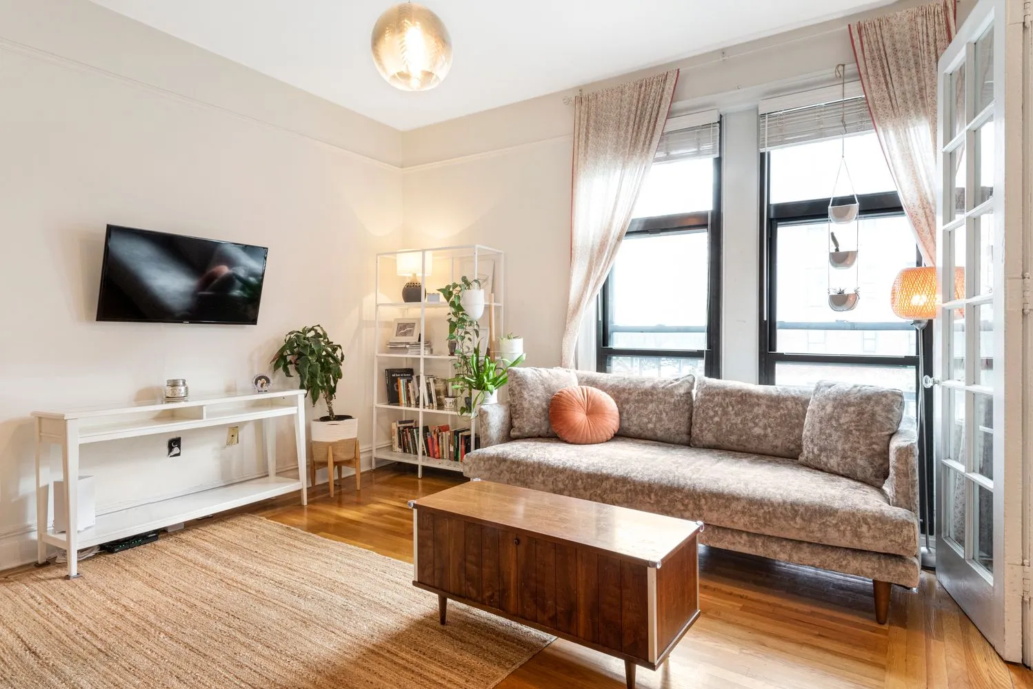 a living room with furniture and a flat screen tv