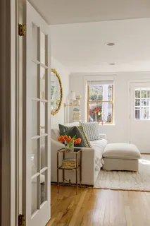 a bedroom with furniture and a window