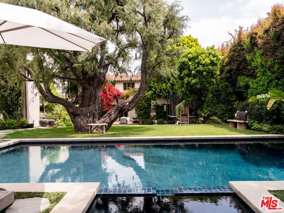 a view of swimming pool with a yard