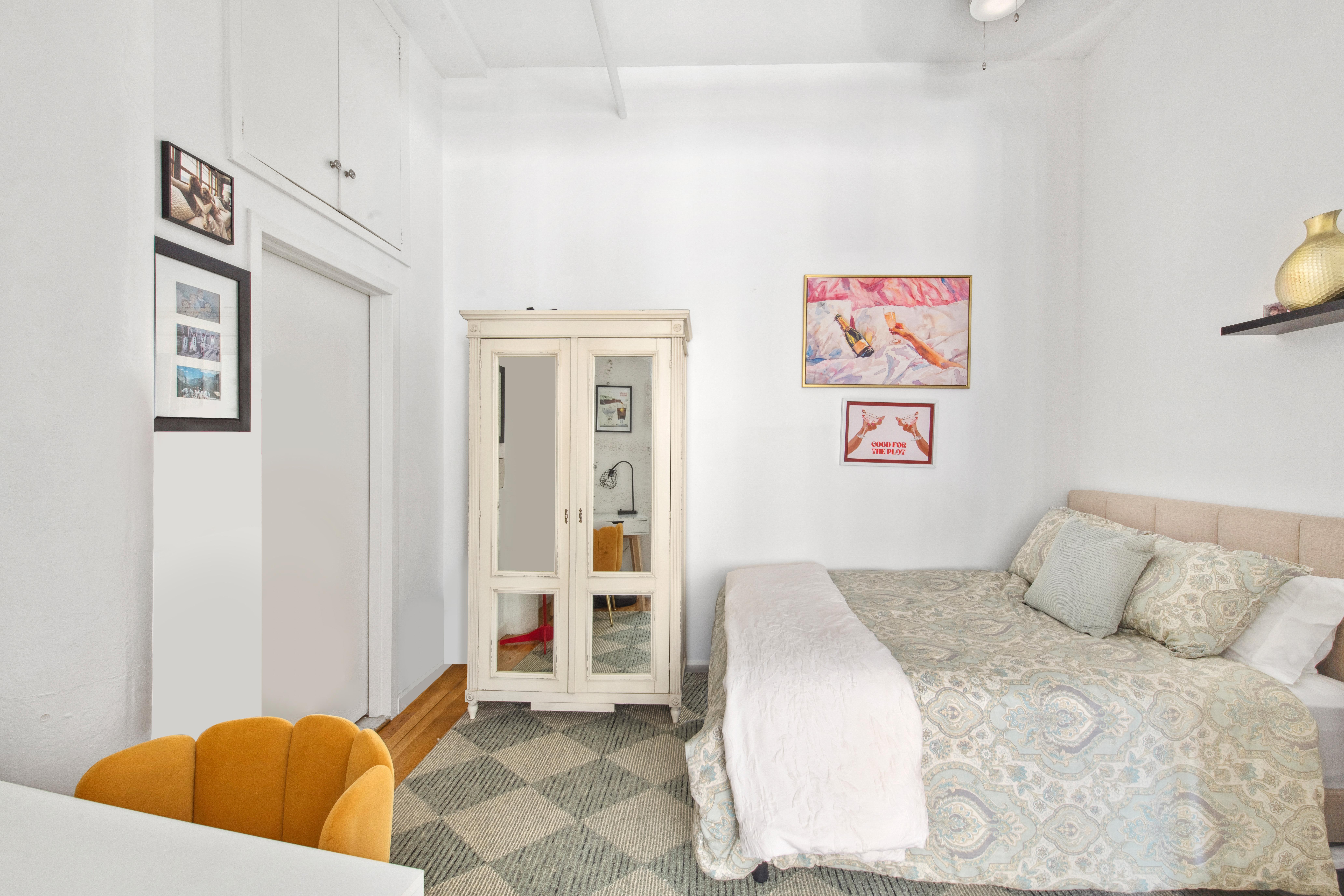 112 West 18th Street, Unit 2A Manhattan, NY 10011 - Photo 8 of 10 a bedroom with a bed and a window