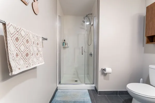 a view of walk in closet with clothes