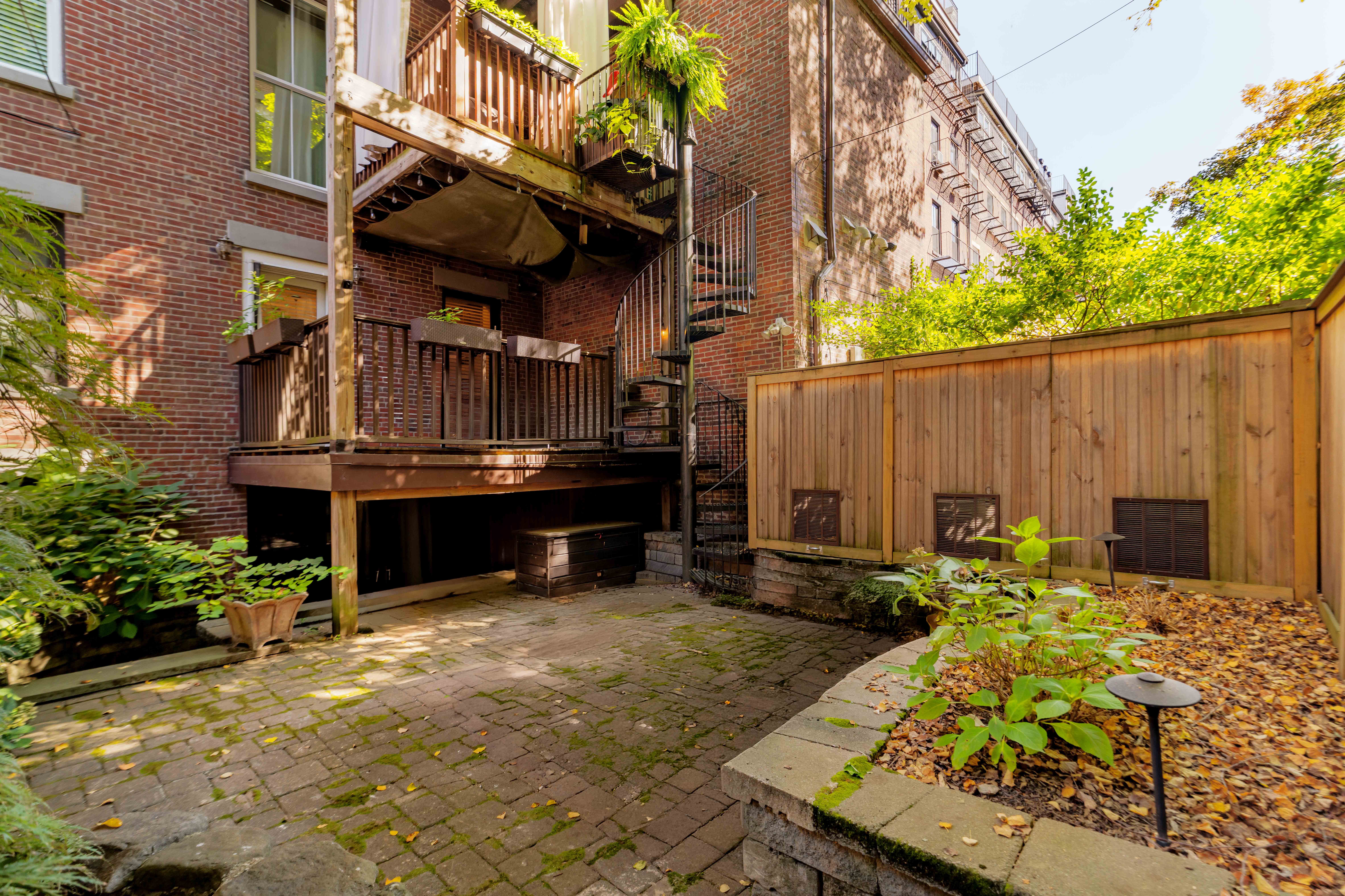 92 Waltham Street, Unit 1A Boston, MA 02118 - Photo 8 of 18 a view of a backyard with sitting area