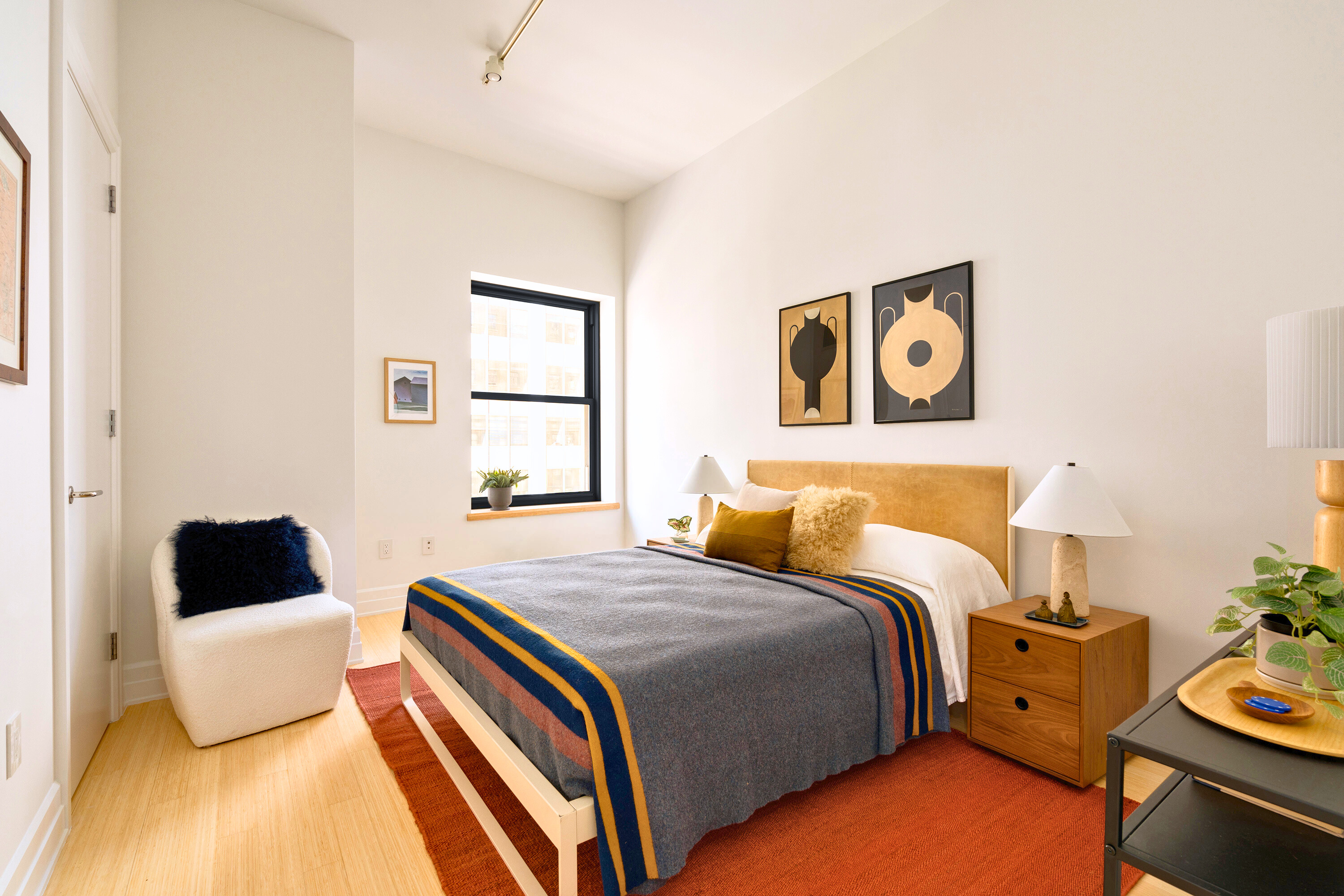 110 Livingston Street, Unit 6C Brooklyn, NY 11201 - Photo 13 of 26 a bedroom with a bed and wooden floor