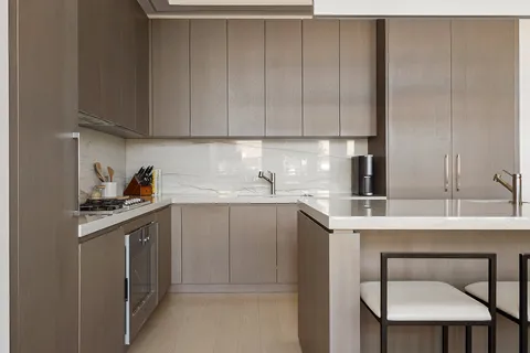 a kitchen with a sink cabinets and appliances