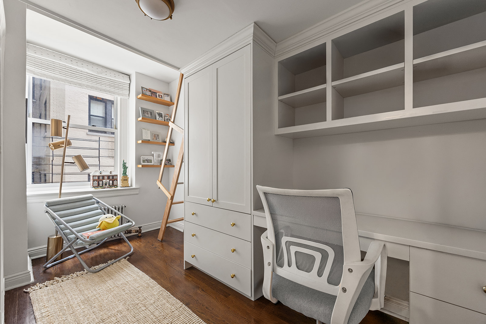 895 West End Avenue, Unit 1B Manhattan, NY 10025 - Photo 16 of 23 a livingroom with furniture and windows