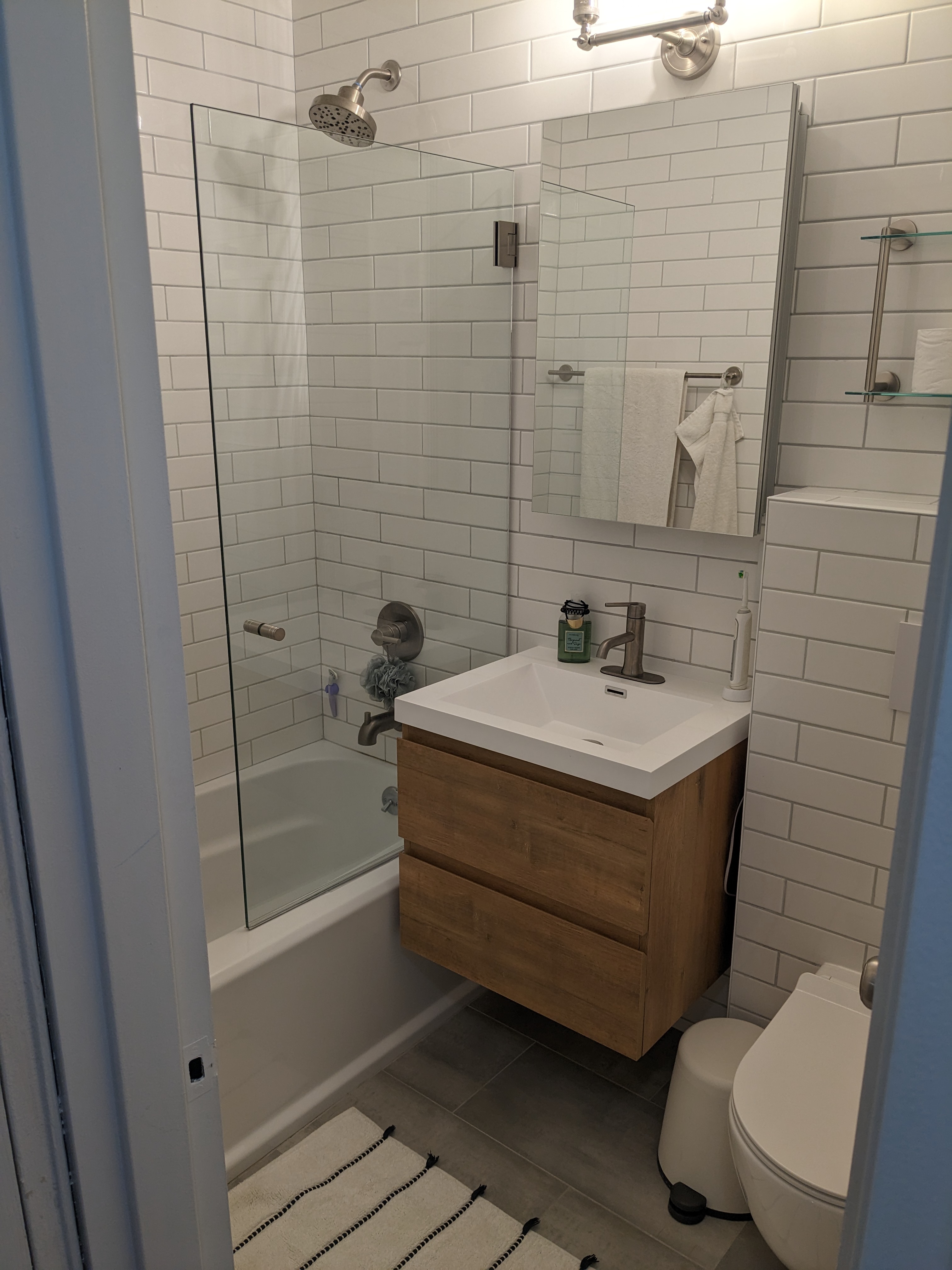 310 Lenox Road, Unit 3D Brooklyn, NY 11226 - Photo 8 of 9 a bathroom with a sink a toilet and shower