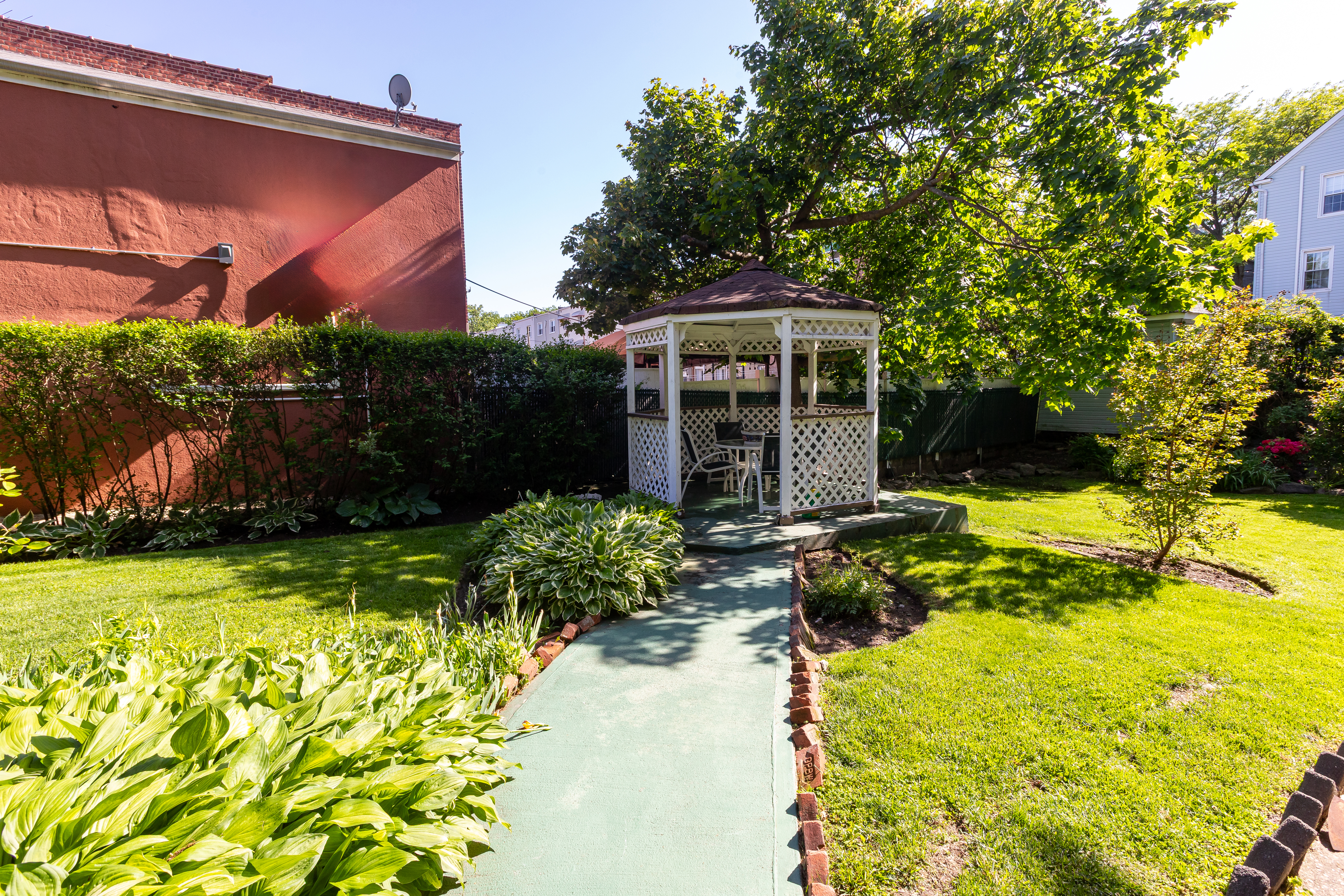 4167 Bruner Avenue Bronx, NY 10466 - Photo 14 of 16 a front view of house with yard and green space