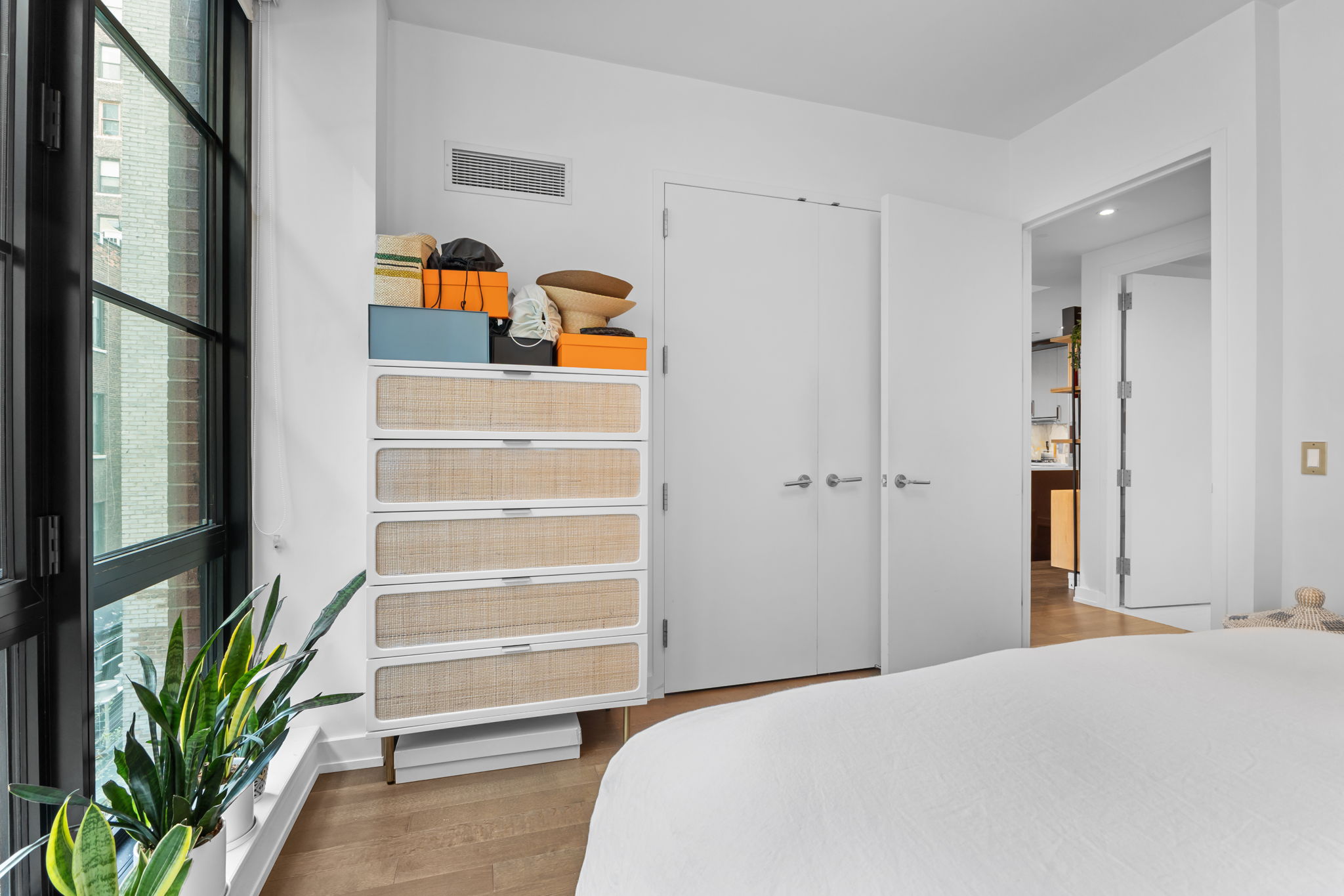 261 West 25th Street, Unit 4A Manhattan, NY 10001 - Photo 9 of 16 a bedroom with a bed and ceiling fan