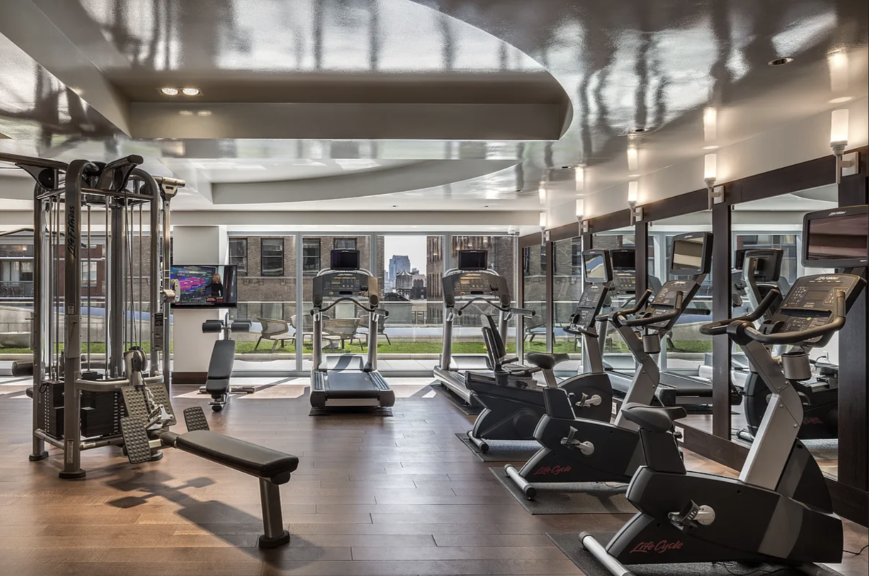35 West 15th Street, Unit 14D Manhattan, NY 10011 - Photo 13 of 18 a living room with lots of gym equipment