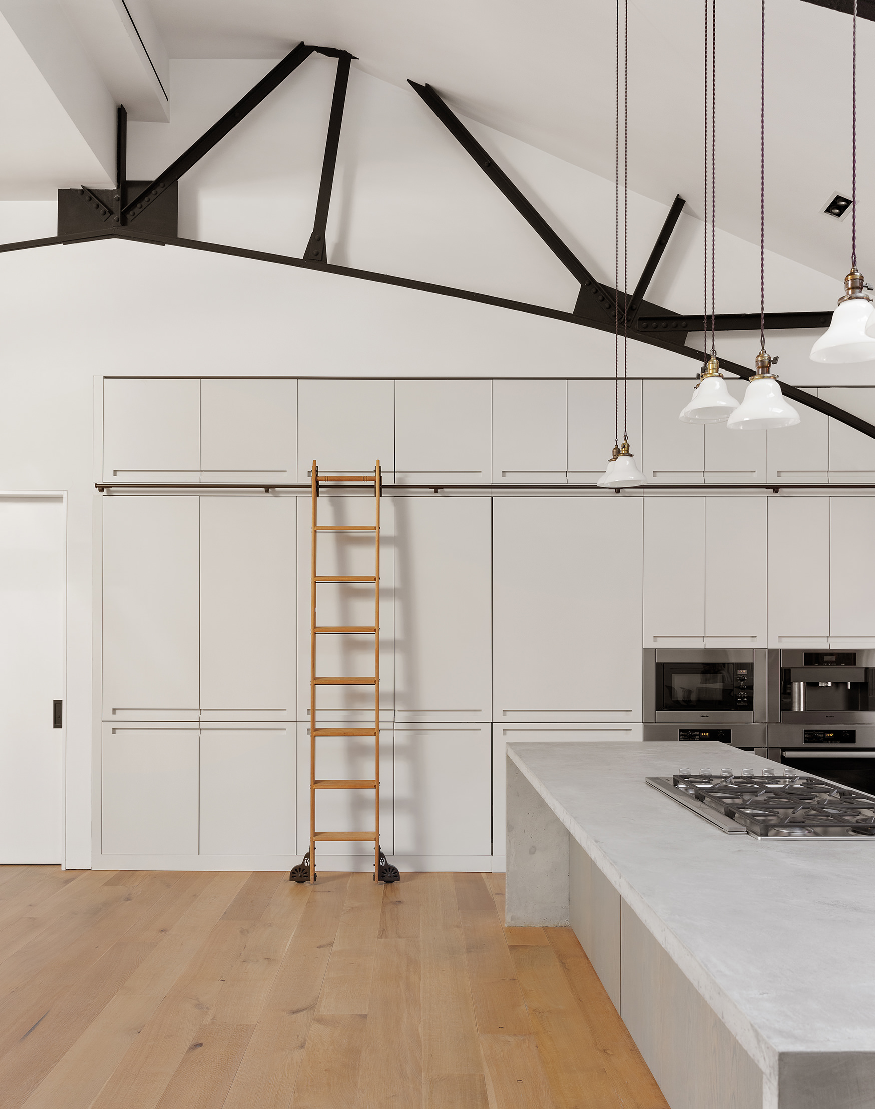 240 Centre Street, Unit 6N Manhattan, NY 10013 - Photo 8 of 16 a view of a kitchen with a sink and cabinets