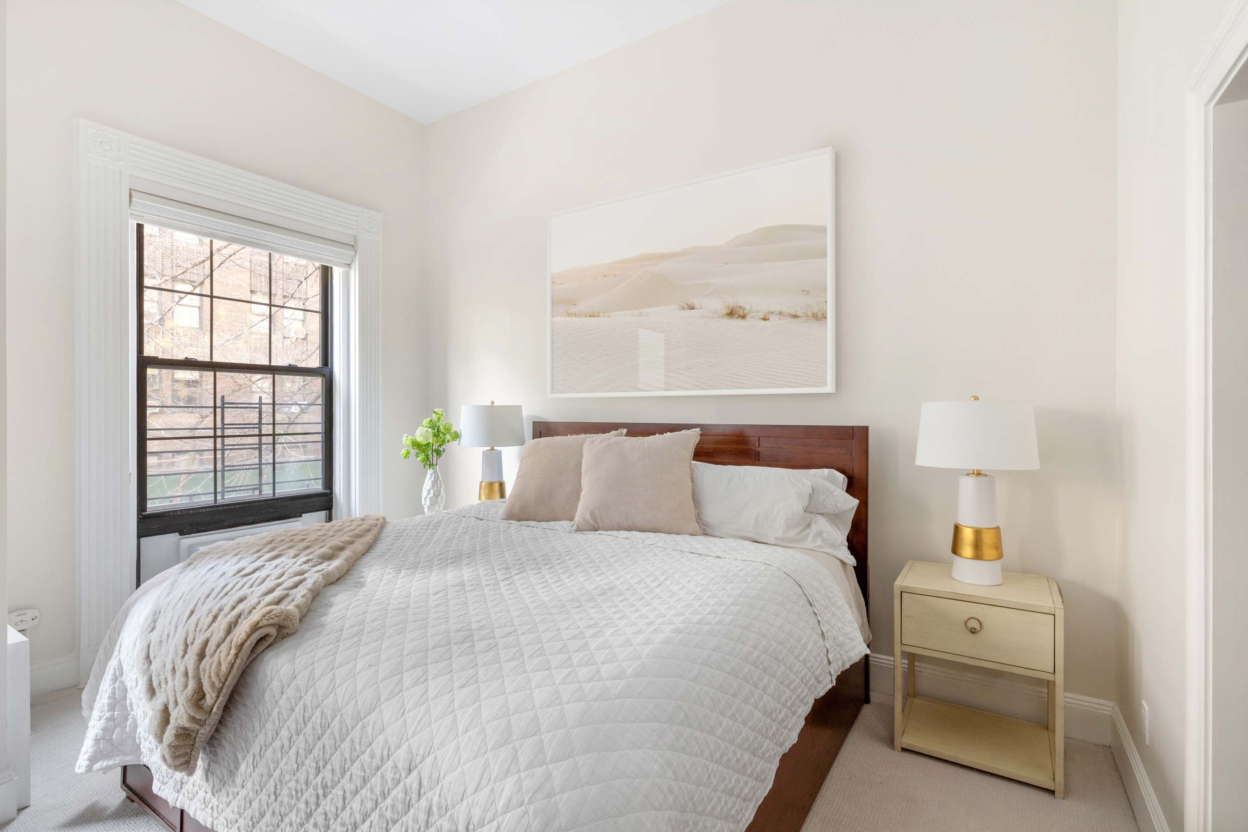 107 East 38th Street, Unit 2AB Manhattan, NY 10016 - Photo 5 of 13 a bedroom with a bed and a window