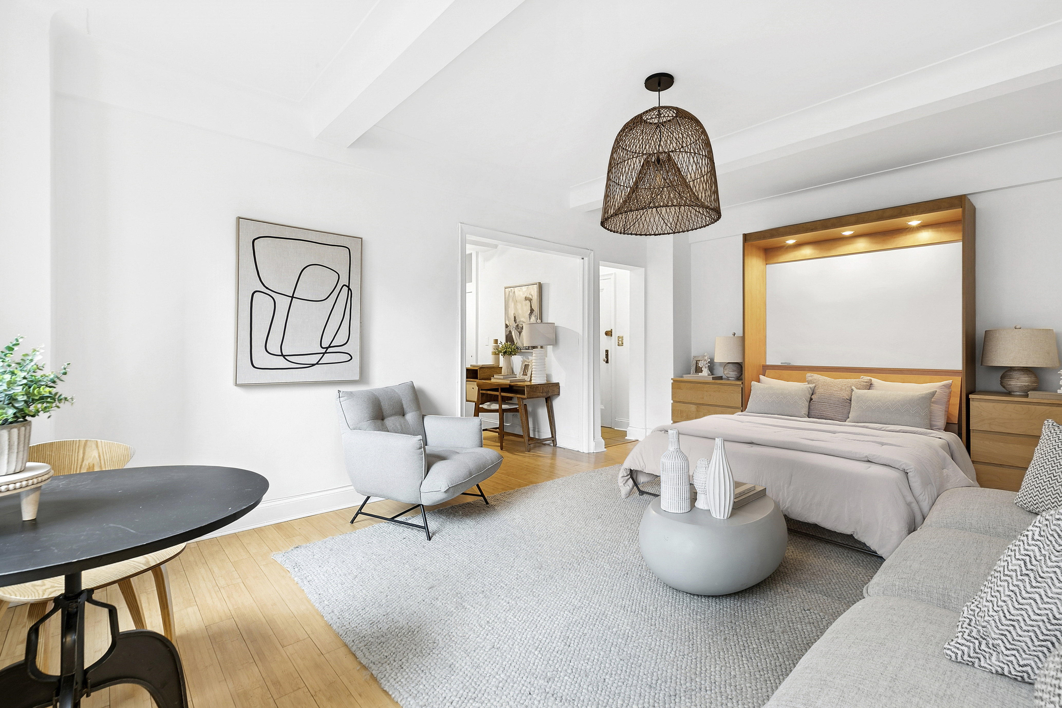 a bedroom with furniture and a window