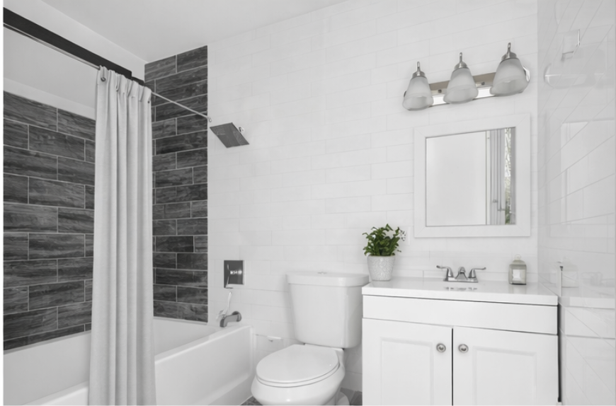 1423 Dekalb Avenue, Unit 2I Brooklyn, NY 11237 - Photo 4 of 5 a bathroom with a sink a toilet and shower