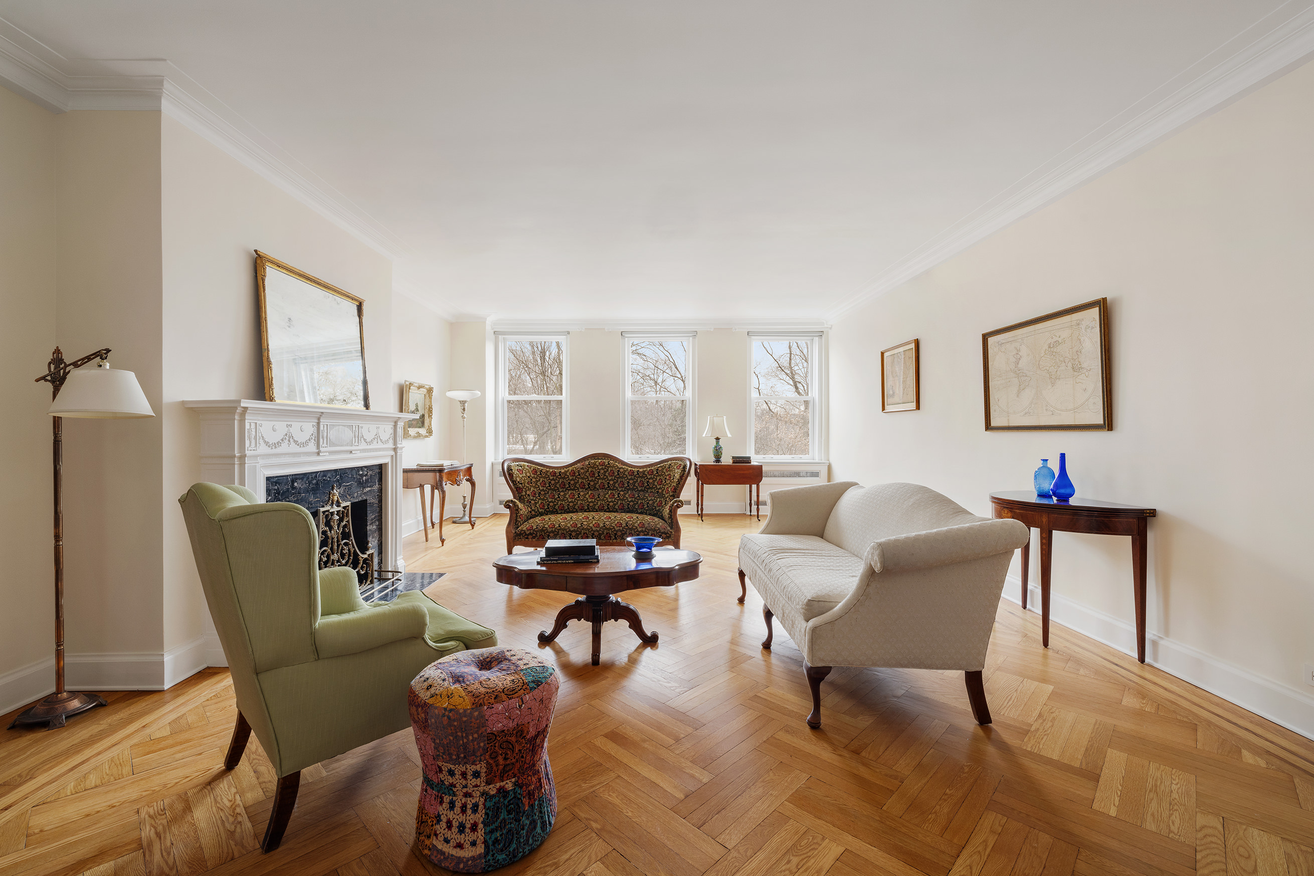 35 Prospect Park West, Unit 3B Brooklyn, NY 11215 - Photo 2 of 16 a living room with furniture a fireplace and a window