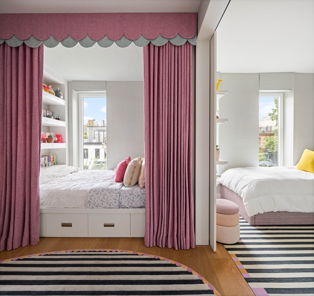 a bedroom with bed and a window