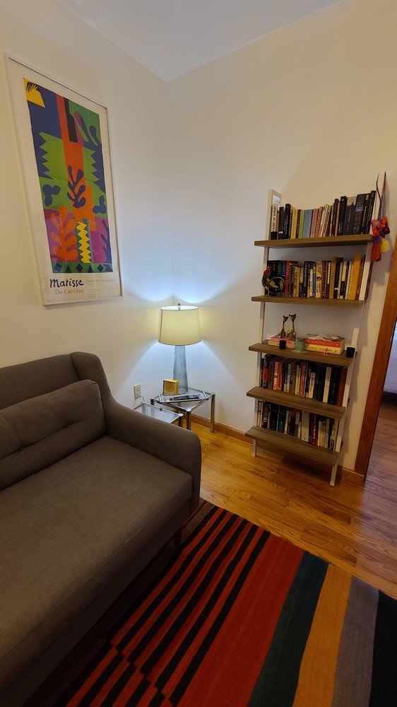 562 Fairview Avenue, Unit 1R Queens, NY 11385 - Photo 6 of 11 a living room with furniture and a wooden floor