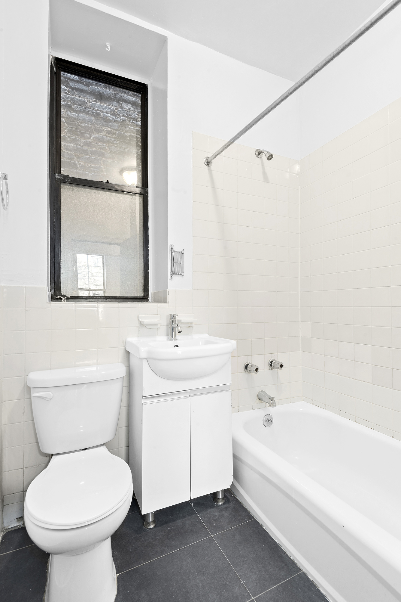 570 Jefferson Avenue, Unit 4 Brooklyn, NY 11221 - Photo 6 of 8 a bathroom with a toilet sink and bathtub