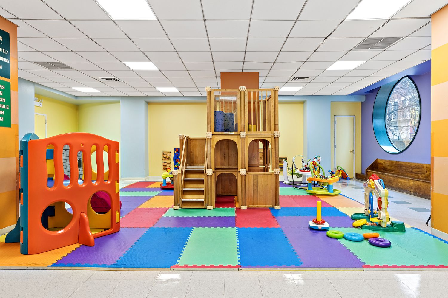 225 West 83rd Street, Unit 19A Manhattan, NY 10024 - Photo 12 of 15 a room with toys and a dining table with paintings on the wall