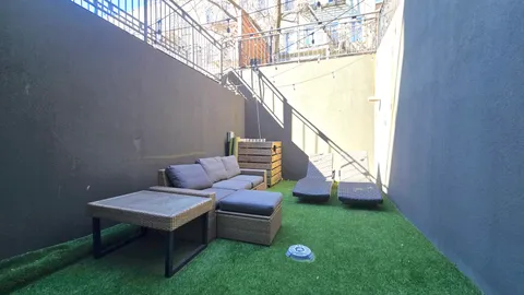 a view of yard with outdoor seating