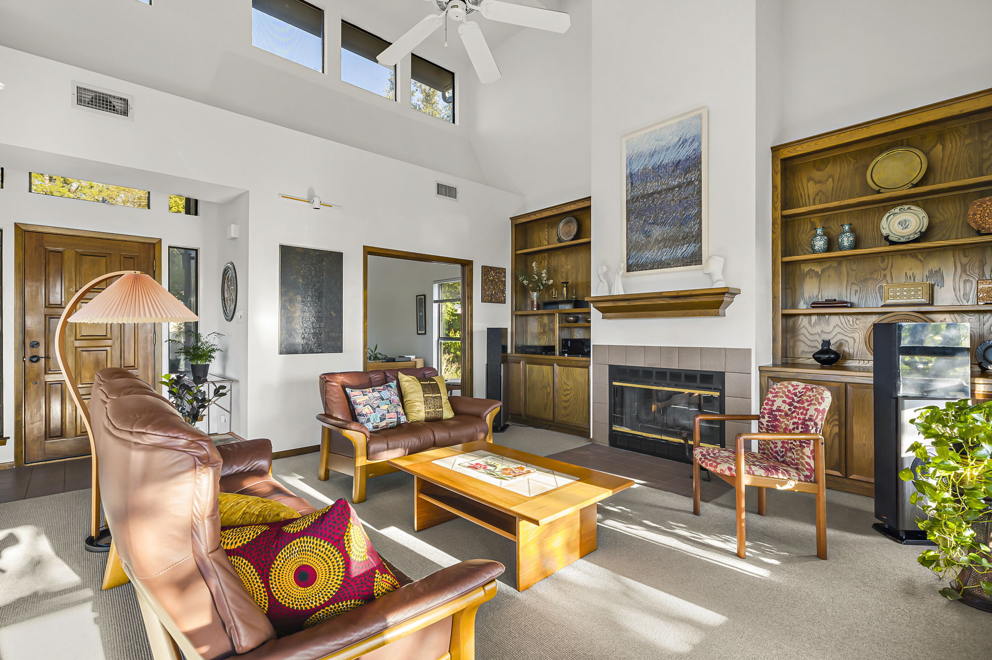 1605 The High Road Austin, TX 78746 - Photo 6 of 45 a living room with furniture a fireplace and a table