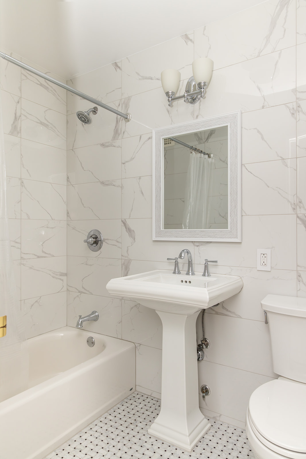 132 East 35th Street, Unit 7H Manhattan, NY 10016 - Photo 15 of 25 a bathroom with a sink a toilet and shower